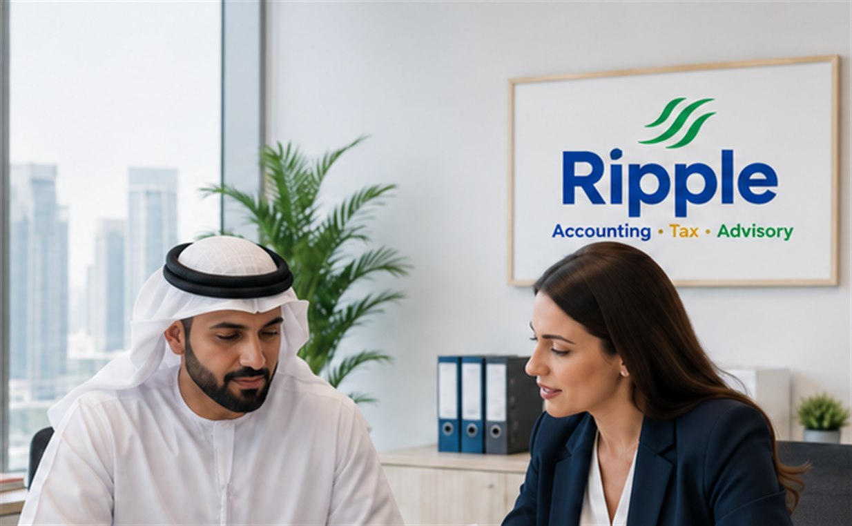 Ripple advisor and client reviewing audit documentation in a Dubai office